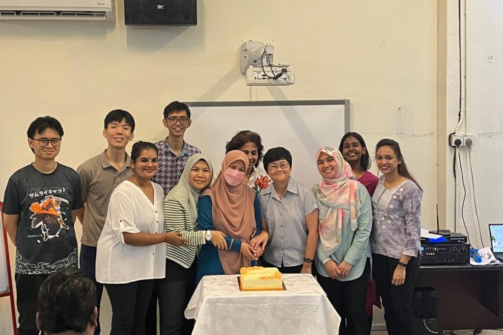 Group of teachers are cutting cake in conjunction for teacher's day celebration