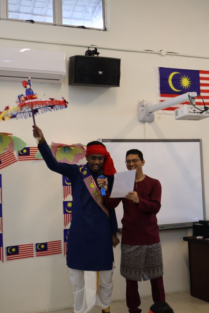 A kid waving an umbrella