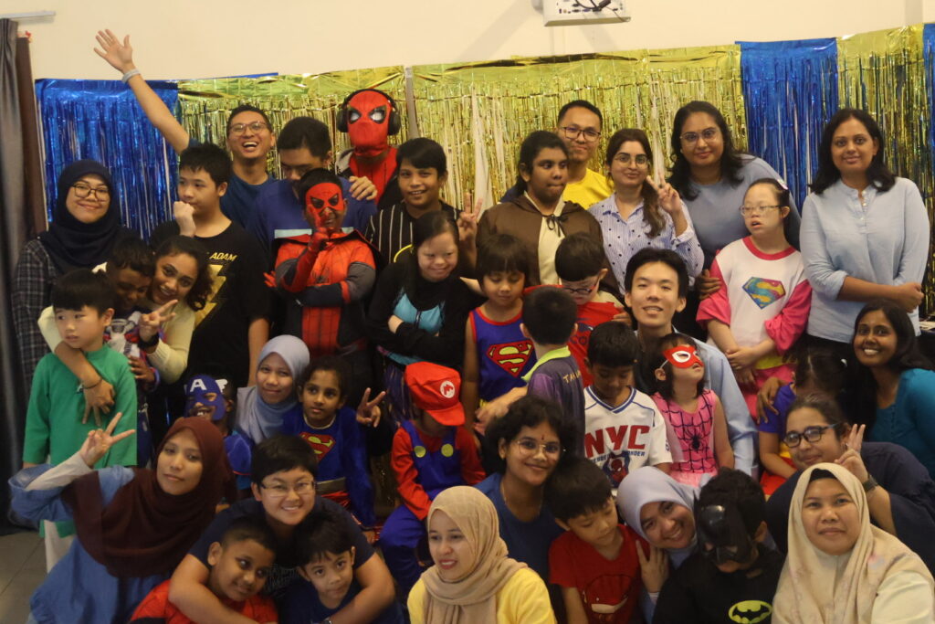 Students together pose for down syndrome awareness celebration