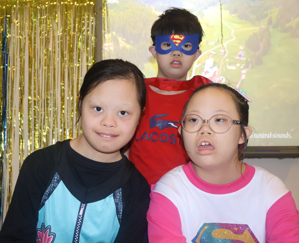 Children post for down syndrome celebration